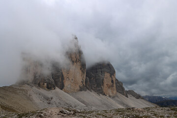 Tre Cime di Lavaredo close-up, Dolomites cliffs obscured by drifting fog and haze