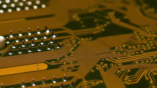 A high-resolution macro shot of a yellow printed circuit board (PCB), showing dense copper traces and contact pads. Visualization of high-precision electronics and PCB design.