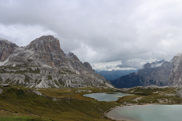 Naklejka premium Wide panorama of Dolomites, alpine lakes near Locatelli Hut beneath towering peaks