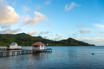 Sunset at Hurepiti Bay with Stilt Houses on Tahaa Island