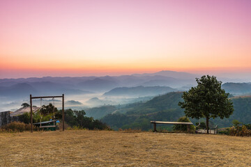 Beautiful sunrise in the morning with sea of mist on hight moutain, Mon Mok Tawan, Tak Province, Thailand.