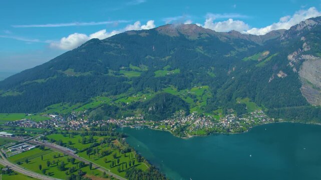 Aerial view of city Weesen beside the lake walensee in Switzerland on a sunny day in summer.