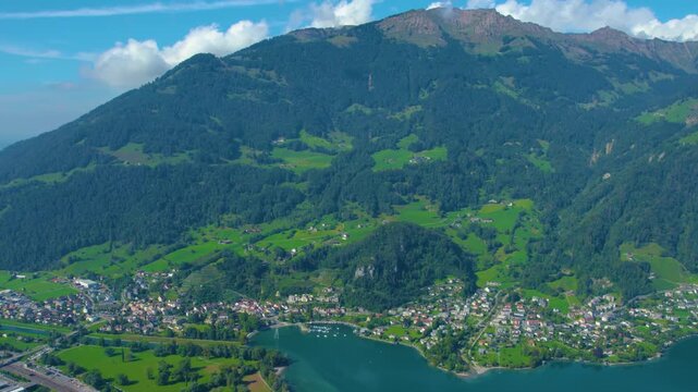 Aerial view of city Weesen beside the lake walensee in Switzerland on a sunny day in summer.