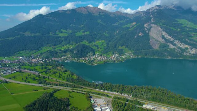 Aerial view of city Weesen beside the lake walensee in Switzerland on a sunny day in summer.