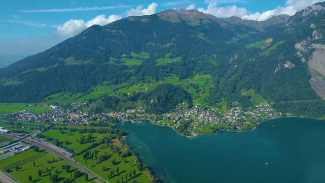 Aerial view of city Weesen beside the lake walensee in Switzerland on a sunny day in summer.