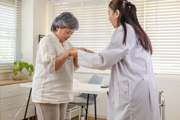 Obraz premium Clinic rehabilitation private care, physician encourages senior patient walking with walker, safe movement instruction, balance training, fall prevention screening, progress review appointment.