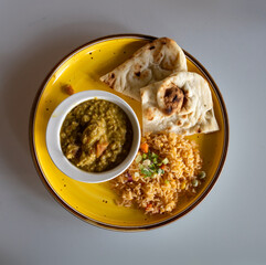 Delicious Plate of Dal with Rice and Naan