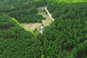 Naklejka premium Solar RV parked in wilderness clearing