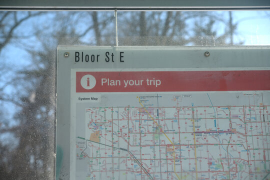 Toronto Transit Commission ride-guide surface route map inside a bus shelter on Bloor St E
