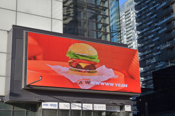 Fototapeta premium A&W digital billboard advertising located on the exterior of Yonge Eglinton Centre, a shopping mall, located at 2300 Yonge St, Toronto