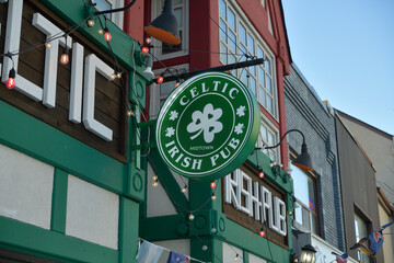 Fototapeta premium round projecting sign outside Celtic Irish Pub located at 1954 Yonge St, Toronto