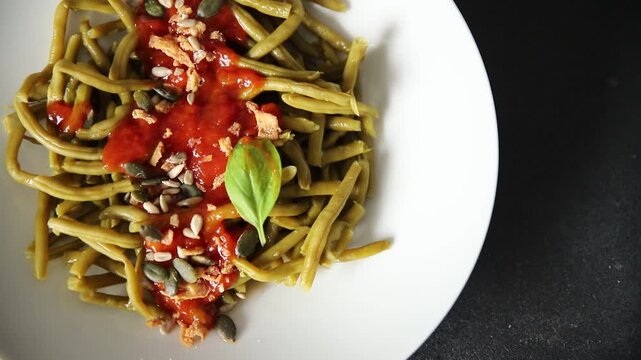 Green string beans tomato sauce main course natural food appetizer tasty snack fresh gourmet food background on the table rustic food top view copy space keto and paleo diet vegetarian and vegan food