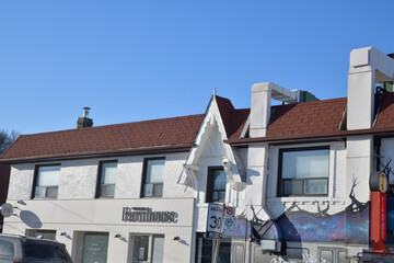 Fototapeta premium exterior building facade and sign of Forest Hill Farmhouse, a restaurant, located at 2 Lola Rd west of Yonge St, midtown, Toronto