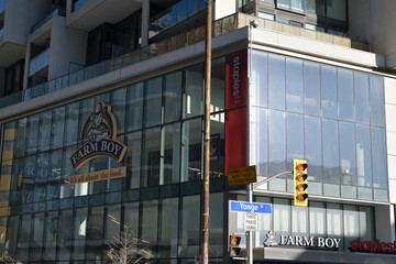Fototapeta premium exterior building facade and signs outside Farm Boy, a food market, located at 2149 Yonge St, Toronto