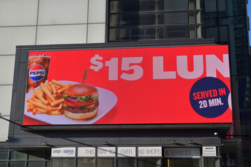 Fototapeta premium electronic billboard of a fast food restaurant on the exterior of Yonge Eglinton Centre (Eglinton Av W), Toronto