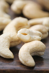 Fototapeta premium Fresh Raw Cashew Nuts on Wood - Vietnam Snack Food