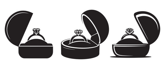 Three engagement rings in open boxes silhouette