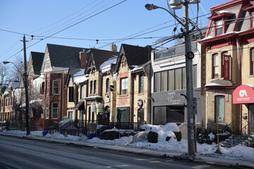 Fototapeta premium Cowley Abbott Fine Art sign and historic houses on Dundas St W (opposite the Art Gallery of Ontario), Toronto