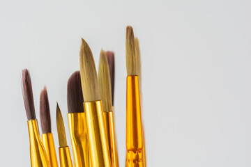 Fototapeta premium artist paint brushes background set of various brushes for painting creative workshop tools on white background with copy space for banner design concept of art education, hobby, creativity