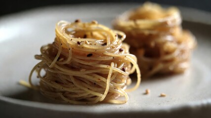 Close up seasoned rice noodles with sesame and spices