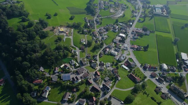 Aerial view around the mountains in Liechtenstein beside the village Triesenberg on a cloudy summer morning