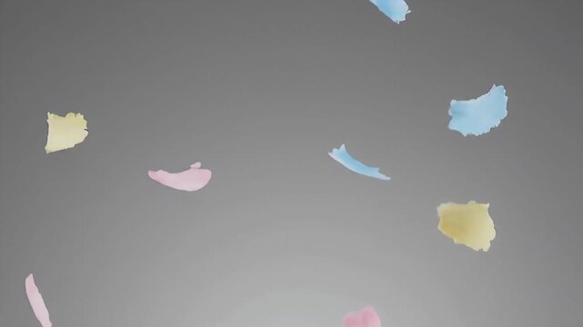Colorful fragments falling in a gray gradient background scene from a high viewpoint