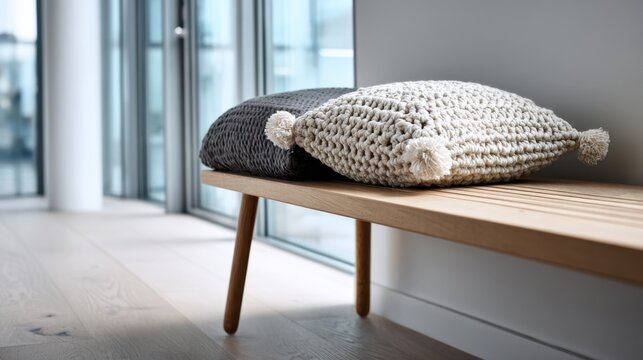 Cozy cushions on wooden bench by sunlit window for modern minimalist home decor and relaxation,national crochet month