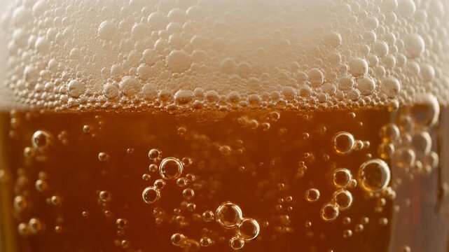 Close up of beer bubbling foam animation.