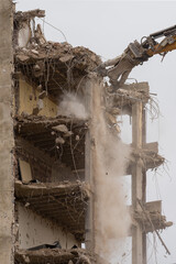 Demolition of a building using hydraulic shears