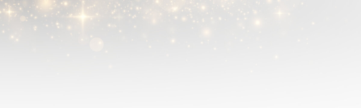 Sparkling bokeh with glowing stardust and magical particles, golden flare and shiny confetti across a bright abstract christmas background.
