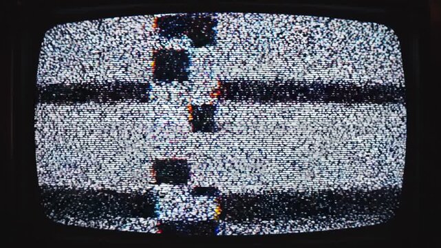 Vintage television displaying static black-and-white noise
