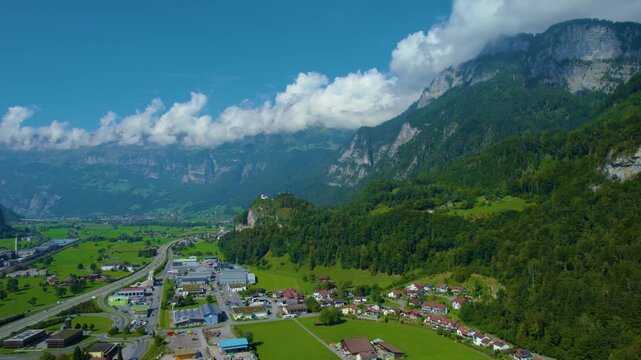 Aerial panoramic view around the old town city of Flums  in Canton Sankt Gallen in Switzerland on a sunny spring day.
