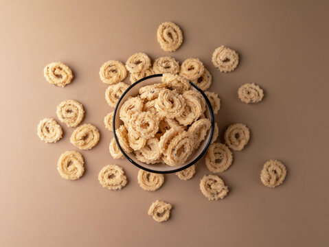 Murukku a south Indian snack on beige background.
