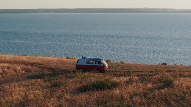 Camper van driving on a coastal road trip
