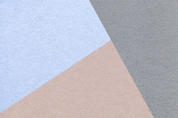 Fototapeta premium Geometric triangular light blue beige gray textured paper background with copy space for banner template