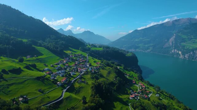 Aerial view of the village Obstalden beside the lake walensee in Switzerland on a sunny day in summer.