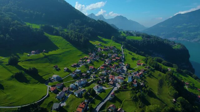 Aerial view of the village Obstalden beside the lake walensee in Switzerland on a sunny day in summer.