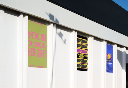 Real photo of warehouse facade with three posters. PSD mockup.