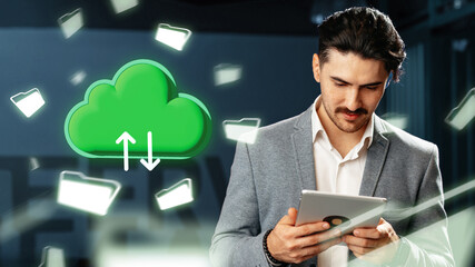 Man using tablet with cloud storage symbol in modern office setting