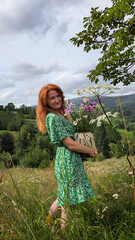 A girl with a bouquet of wild flowers