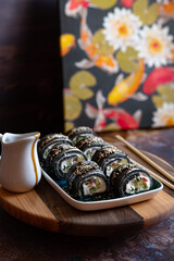 Black sushi roll made from pancakes