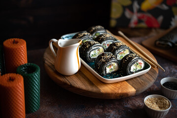 Black sushi roll made from pancakes