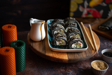 Black sushi roll made from pancakes