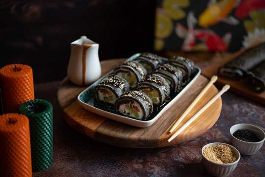 Black sushi roll made from pancakes