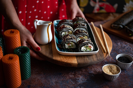 Black sushi roll made from pancakes