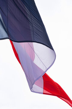 France, Paris, 75, 8th arrondissement, Place du General de Gaulle, close-up of the French flag under the Arc de Triomphe, on the occasion of the Victory Day on May 8, 1945.