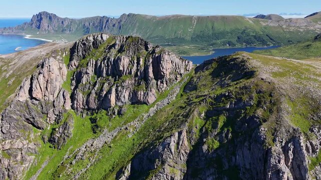 forward drone flight above  ocean, towards M&aring;tind, Matind mountain on Vesteralen, Vester&aring;len islands. Bleikmorenen en bleik visible. Amazing nature, outdoor travel destination, hiking area. Beautiful 