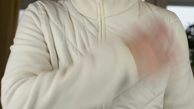 Hand Rubbing Against Synthetic Textile Jacket Fabric Surface with Sound