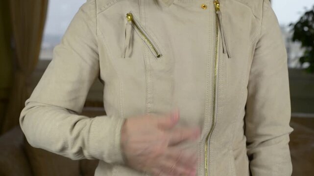 Hand Rubbing Against Beige Genuine Leather Jacket Surface with Sound
