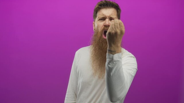 Man with a long beard makes a beckoning gesture with an open mouth in a purple studio; invitation urgency.